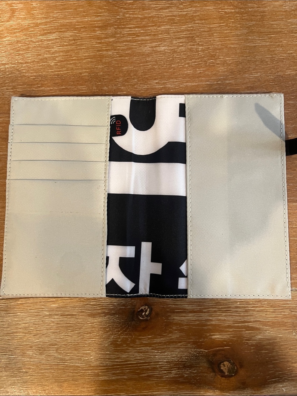 Sherpani iFloral Accent Passport Wallet with Black Strap - Picture 2 of 2